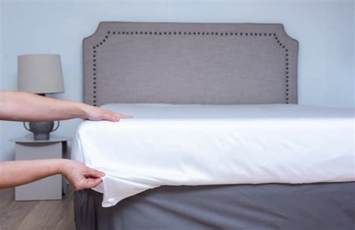 What is the correct way to put on a flat sheet?